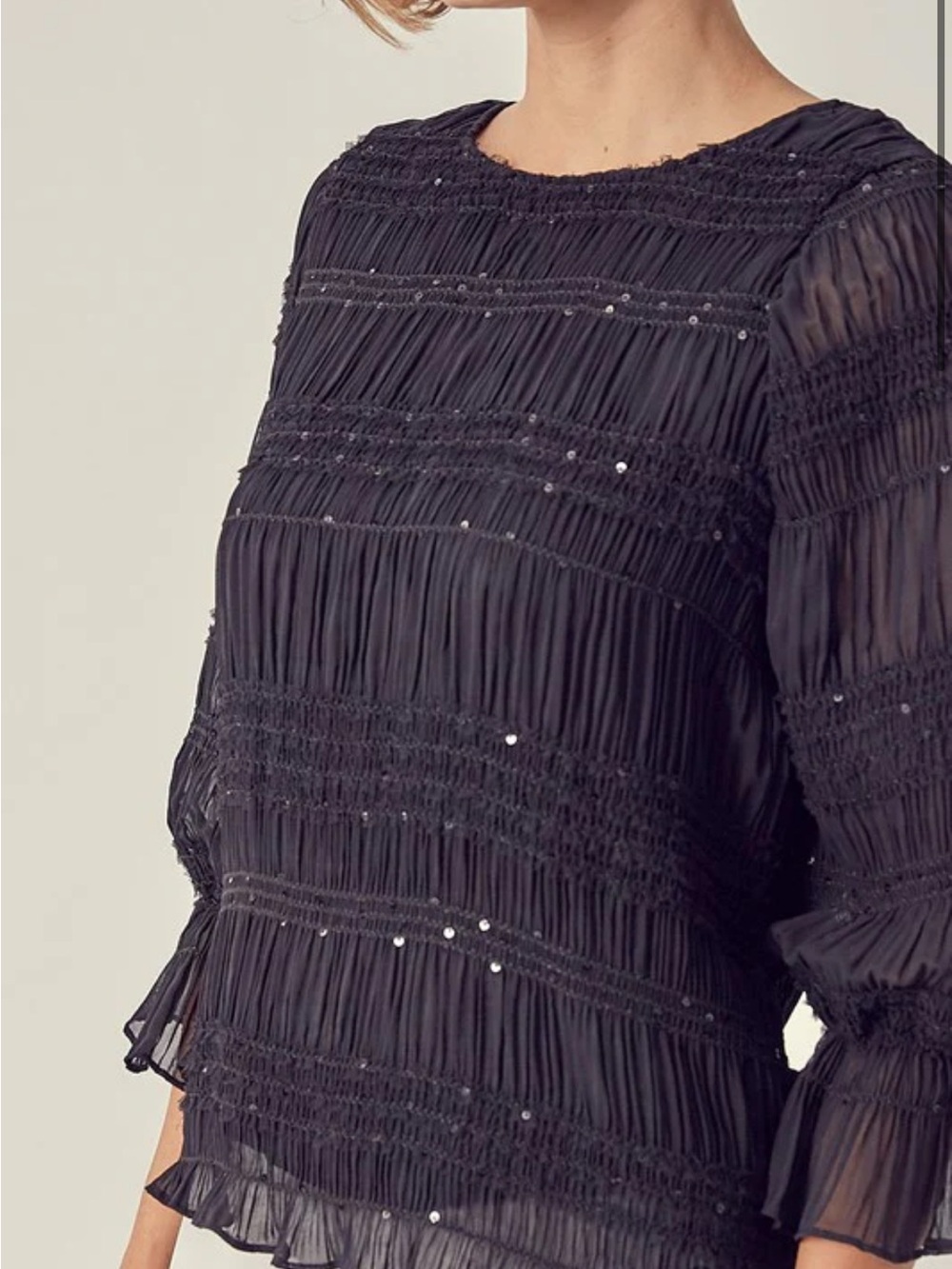 DO+BE smocked top featuring long ruffled sleeves Size S